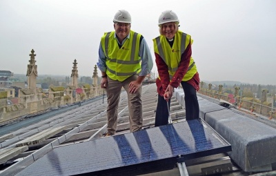 Canon-Celia-Thomson-bolts-in-the-first-solar-panel-at-Gloucester-Cathedral-watched-on-by-MyPower-managing-partner-Ben-Harrison.jpg